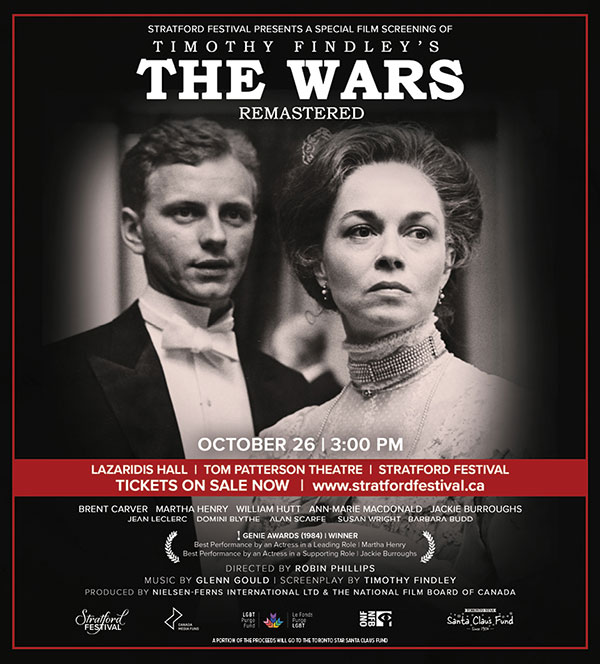 A playbill for a special screening of The Wars, a remastered film adaptation of Timothy Findley's novel, presented by the Stratford Festival. The black-and-white image features two solemn characters in period attire: a man in a tuxedo and a woman in a high-necked dress. The screening is on October 26 at 3:00 PM at Lazaridis Hall, Tom Patterson Theatre, with tickets available at stratfordfestival.ca. Cast members include Brent Carver and Martha Henry, and a portion of proceeds will support the Toronto Star Santa Claus Fund.